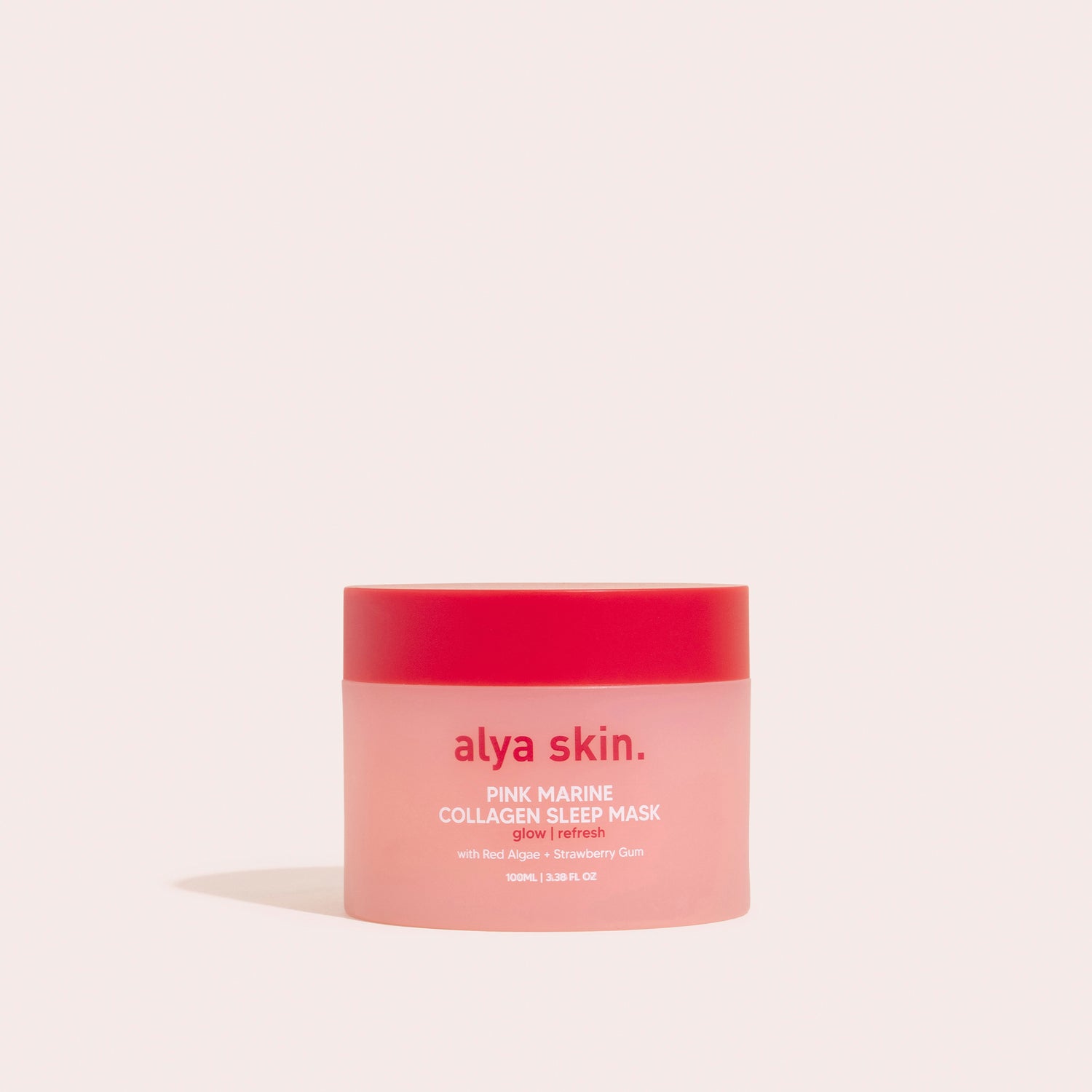 A jar of Alya Skin Pink Marine Collagen Sleep Mask on a beige background.